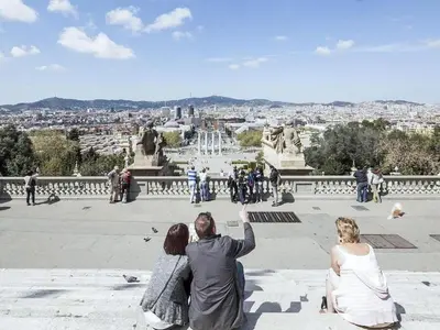 a group of people walking in front of a fountain at Penthouse in Barcelona with Large Terrace in Barcelona