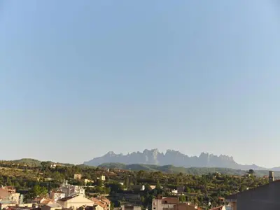 a view of a city with mountains in the background at Penthouse in Barcelona with Large Terrace in Barcelona