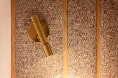 a wooden door with a door knocker on a wall at The Diagonal Suites by Sweett in Barcelona