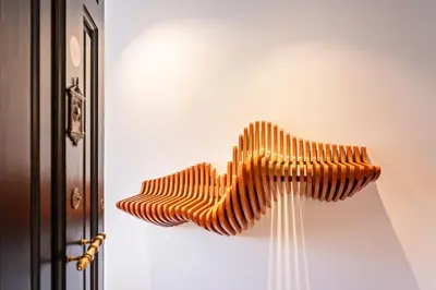 a group of wooden objects hanging from a wall at The Diagonal Suites by Sweett in Barcelona