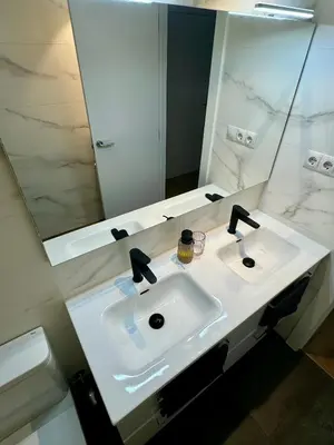 a bathroom with a white sink and a mirror at Apartamento Ideal en Poblenou in Barcelona