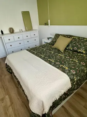 a bedroom with a bed with a dresser and a bed sidx sidx at Apartamento Ideal en Poblenou in Barcelona