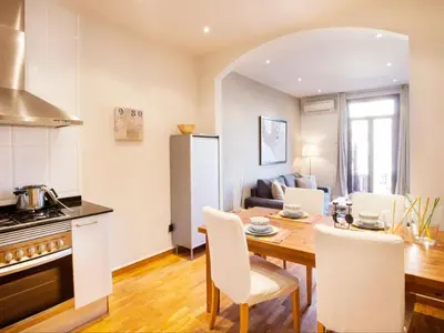 a kitchen and dining room with a table and chairs at Premium apartment in Barcelona in Barcelona