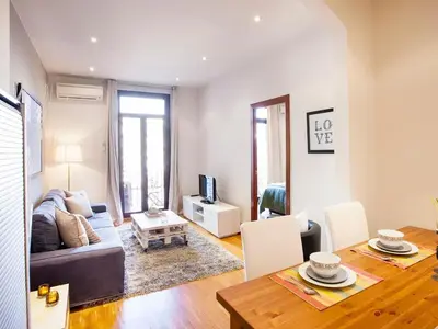 a living room with a couch and a table at Premium apartment in Barcelona in Barcelona