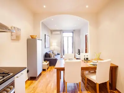 a kitchen and dining room with a table and chairs at Apartment in Barcelona near the Beach in Barcelona