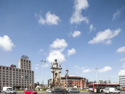 a city with a statue in the middle of a street at Apartment in Barcelona near the Beach in Barcelona