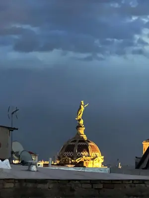 a statue of a woman on top of a building at Atico Central con Terraza in Barcelona