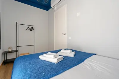 a room with white walls and a sliding door at Joan Blanques Apartment in Barcelona