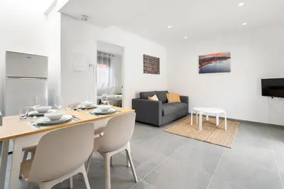 a living room with a table and a couch at Fira Building in Hospitalet de Llobregat