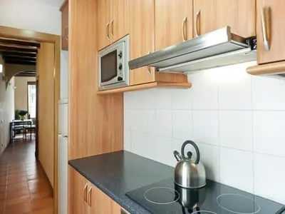 a kitchen with a tea kettle on a counter at Luminoso apartamento 1 habitación cerca de Las Ramblas, hasta 4 pers, cocina equipada. - ES-341-6 in Barcelona