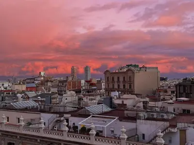a view of a city with a sunset at Apartamento con terraza privada y Wifi en el corazón de Barcelona - ES-341-5 in Barcelona