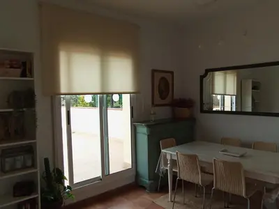 a dining room with a table and a mirror at Esplendida casa en Valldoreix in Sant Cugat del Vallès