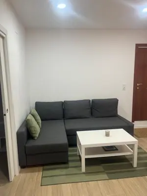 a living room with a couch and a coffee table at Martiapartamento in Hospitalet de Llobregat