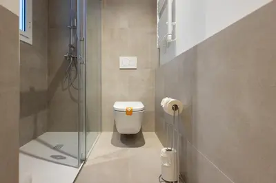 a bathroom with a toilet and a shower at Stay U-nique Apartment Astúries in Barcelona