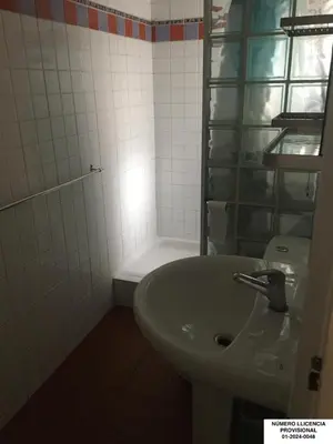 a white bathroom with a sink and a shower at Encanto Gótico Histórico Cerca de Las Ramblas in Barcelona