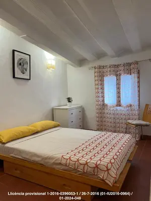 a bedroom with a bed and a window at Encanto Gótico Histórico Cerca de Las Ramblas in Barcelona