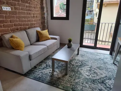 a living room with a couch and a coffee table at ANTIC Manresa 1 in Manresa