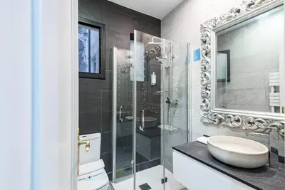 a bathroom with a shower and a sink at The Collection Barcelona - Eixample 3BD Apartment with Private Terrace in Barcelona