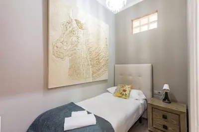 a bedroom with a pink wall and a bed at The Collection Barcelona - Eixample 3BD Apartment with Private Terrace in Barcelona