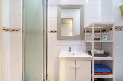 a bathroom with a sink and a shower at El Nido in Gavà