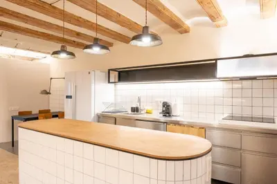 a kitchen with a counter top and some lights at GuestReady - Unique Retreat in Barcelona in Barcelona