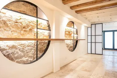 a room with two large windows and a shelf on the wall at GuestReady - Unique Retreat in Barcelona in Barcelona