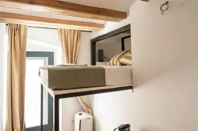 a bunk bed in a room with a window at GuestReady - Unique Retreat in Barcelona in Barcelona