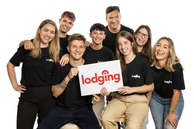 a group of people wearing black shirts holding a sign at Lodging Apartments Almirall Beach 32 in Barcelona