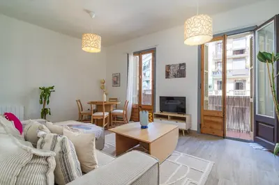 a living room with a couch and a table at GuestReady - Bright apartment with balcony in Barcelona