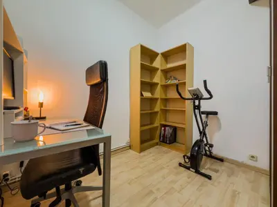 an office with a desk and a chair and a treadmill at GuestReady - Comfortable Retreat next to the beach in Barcelona