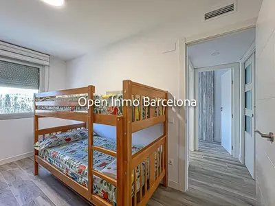 a bedroom with two bunk beds in a room at Apartamento marítimo en Cubelles - OI01958 in Cubelles