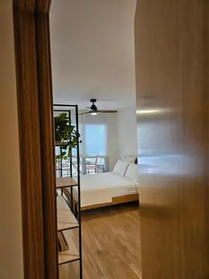 a room with a bed and a ladder leading to a bedroom at EstudioSueñosSuite in Sant Just Desvern