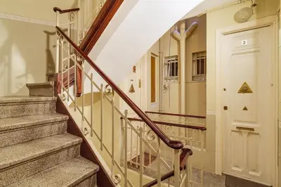 a staircase in a home with a glass door at GuestReady - Precioso refugio en la Barceloneta in Barcelona