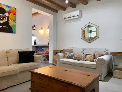 a living room with two couches and a coffee table at Apartment Rafol in Vilanova i la Geltrú