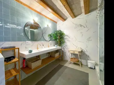 a bathroom with a sink and a mirror at Apartment Rafol in Vilanova i la Geltrú