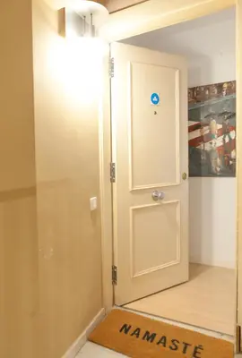 a room with a door with a sign that reads manifest at Plaza Catalunya City Center Apartments in Barcelona