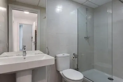 a bathroom with a toilet and a sink and a shower at 4235 - AB Santa Coloma 3 B-I in Santa Coloma