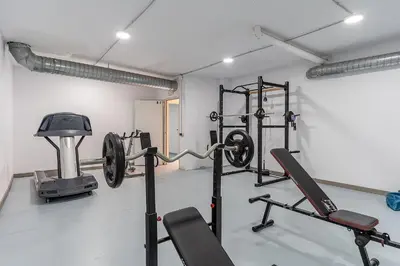 a gym with several equipment in a room at 4236 - AB Santa Coloma III in Santa Coloma