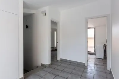an empty room with white walls and a tile floor at 4237 - AB Santa Coloma III in Santa Coloma