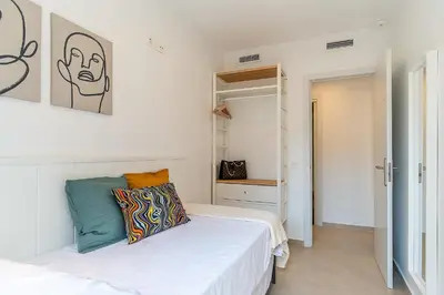 a bedroom with a bed and a closet at 4239 - AB Duplex Santa Coloma III in Santa Coloma