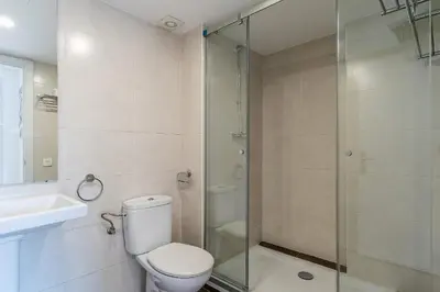 a bathroom with a shower and a toilet and a sink at 4239 - AB Duplex Santa Coloma III in Santa Coloma