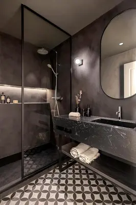 a bathroom with a black sink and a mirror at Luxury Apt with King Beds & Central AC in Heart of BCN in Barcelona