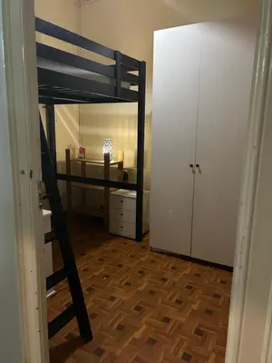 a bedroom with a bunk bed and a closet at Luz's Hut in Barcelona