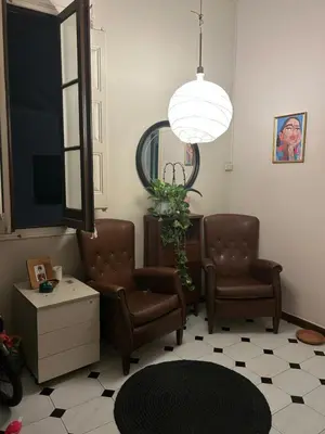 a waiting room with two chairs and a mirror at Luz's Hut in Barcelona