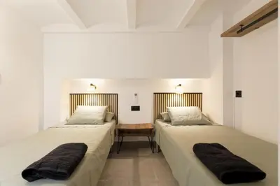 two beds sitting next to each other in a room at Mediterranean Bliss in Sant Adria de Besos