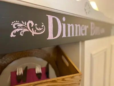 a sign for a dinner table with forks and knives at Bed & Breakfast Wine & Cooking Penedès in Pla del Panadés