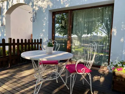a table and two chairs on a patio at Bed & Breakfast Wine & Cooking Penedès in Pla del Panadés