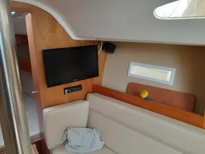 a small room with a flat screen tv on a boat at Velero Viko S30 in Sitges