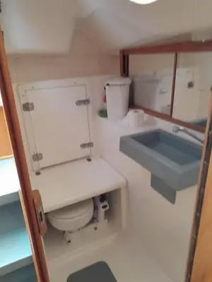 a small bathroom with a toilet and a sink at Velero Viko S30 in Sitges