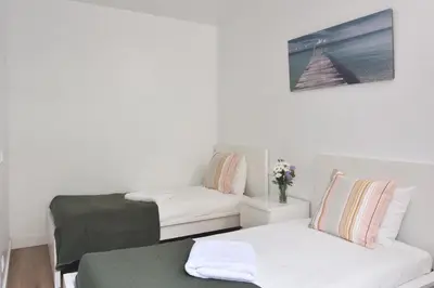 a room with two beds and a couch at Encantador piso en el centro in Barcelona
